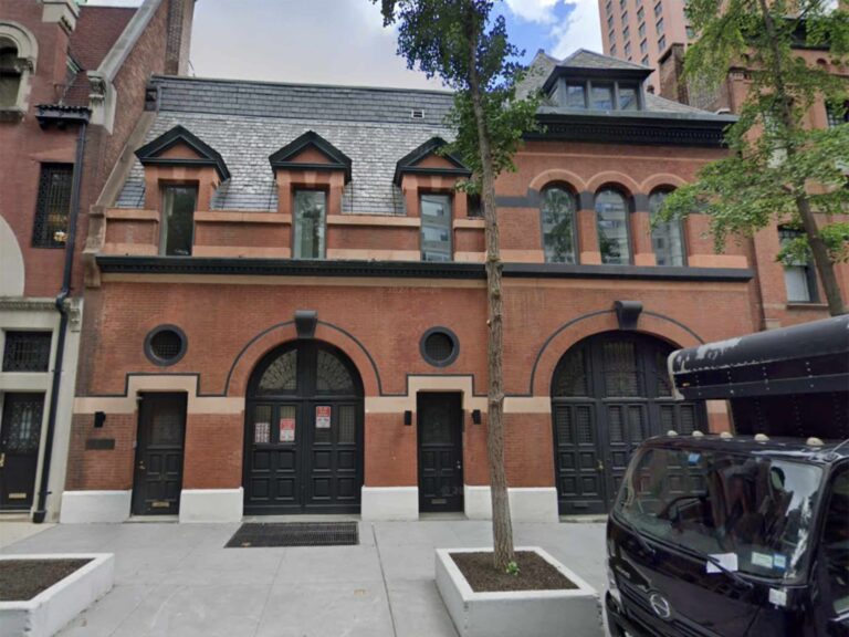 Image shows red mansion.