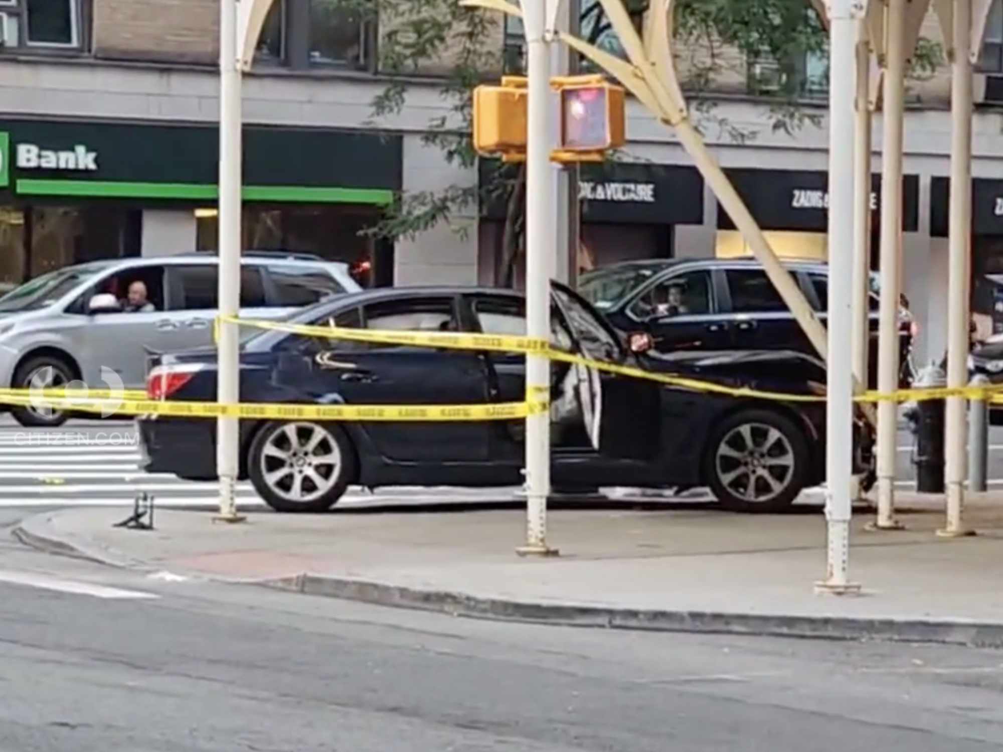 Image shows a crashed sedan.